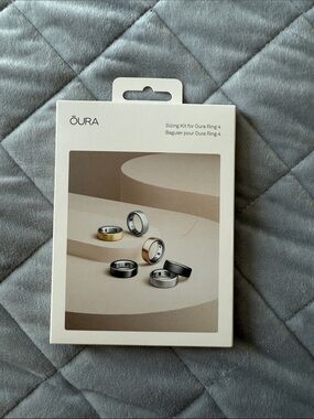 Oura Sizing Kit with Gold, Silver, and Black Ring Images